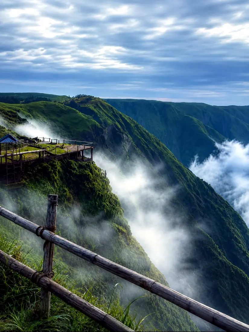 A misty viewing deck perched above the Laitlum canyon, Meghalaya